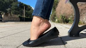 Goddess Solesmad in public dangling with black flats