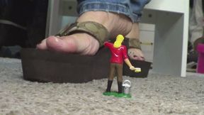 Tiny man and my feet in flip flops