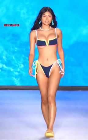 Sports bikini model on runway