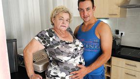 ”Buxxom gilf sucking & fucking a way younger dude in her kitchen”