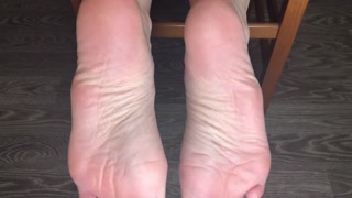 STUDENT GIRL SHOWS WHITE SOCKS AND FEET AFTER STUDYING.