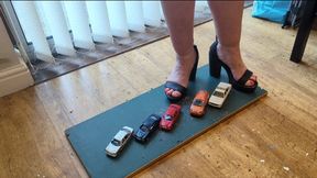 Giantess Lou crushes 5 cars in big black chunky heels high left view