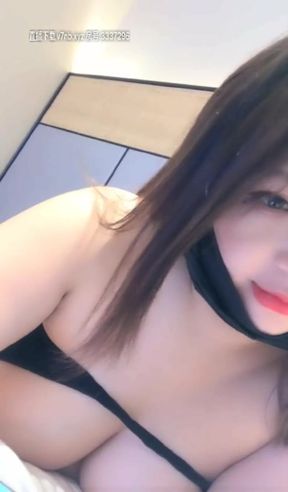 Naughty Asian brunette shows the beauty of her tits