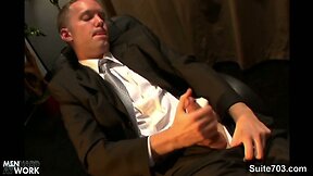 Elegant Sean Preston wanking his large cock at work