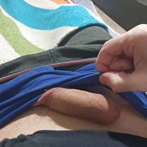 Guy in blue underpants plays with his dick, rubs his dick