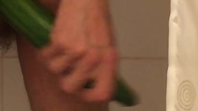 Thin man shoving a massive cucumber in his anus