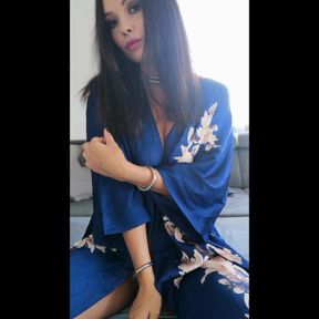 Naked with piercings on the couch