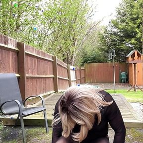 Amateur crossdresser Kellycd2022 sexy milf pissing and masturbating in black seamless pantyhose outdoors