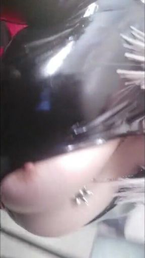 Black latex rubber catsuit and red fetish corset with thigh high boots, selfie video