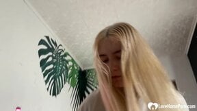 Blonde hottie is on her knees and giving a blowjob