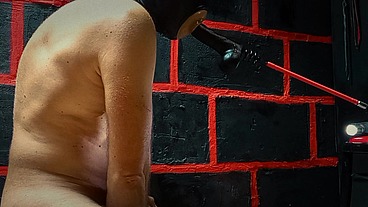 Sucking a rubber cock with a dildo in the ass is his pleasure!