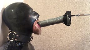 Mechanical fucking of a rubber pig throat