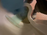 Wanking in urinal with blue nitrile gloves