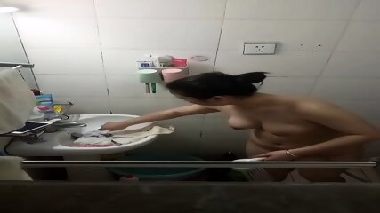D cup young woman taking a bath