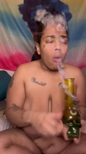 Big Titty Milf smokes while covering her tits in spit