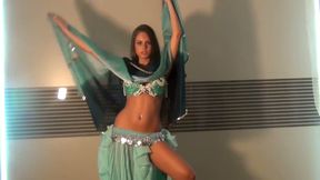 Well shaped girlie dancing seductively in eastern dress