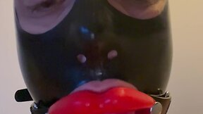Fetish latex doll sissy femboy with lip gag and mask drools - a touching experience