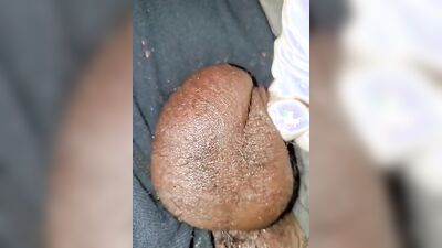 Close-up video of a chap stroking his prick while wearing a gloves