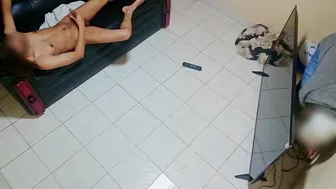 Twink seduces repair guy for a handjob on the sofa