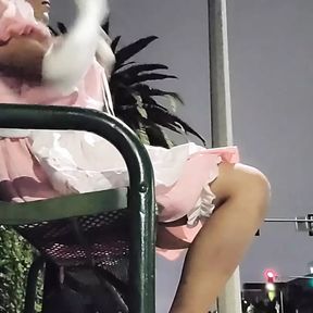 Sissy maid at public bus stop