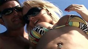 Horny blondie in sunglasses strips on the yacht for winning a stiff dick