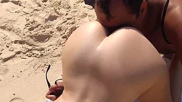 Naughty wife teasing on the nudist beach and enjoys in the mouth of the bastard