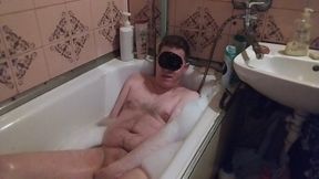 Guy with small cock masturbating in the bathtub and butt plug