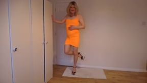 Cute orange party dress, nude pantyhose and high heels