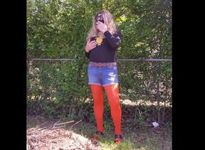 Crossdresser outdoors tease, smoking in nylon pantyhose.