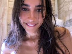 Sexy babe poses naked and plays with herself in the bathroom