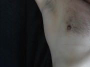 a handsome guy with blue eyes with a big dick jerks off in front of the window