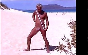 Tanned guy on beach in tiny string thong (temporarily!)