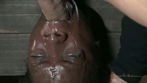 Ugly black chick Ana Foxxx is hung upside down and sucks a cock