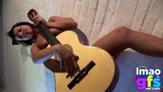 Hot Paul showing her medium tits and pussy with guitar