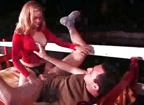 Pegging couple have strap-on fun outdoor.