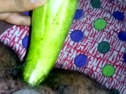 Inserting huge cucumber in asshole