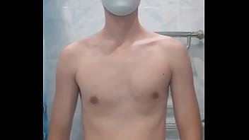 Guy in medical gloves putting on swimcap