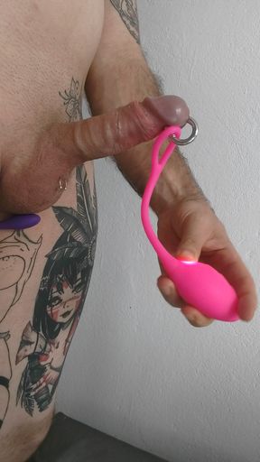 Playing with vibrator on the penis