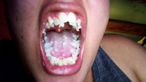 Eating arepas with a giant, wide-open mouth