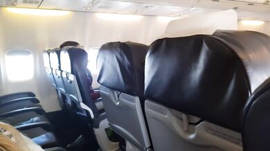 Big tits blonde gets a public airplane blowjob and handjob