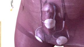 Hands free orgasm in black tights. Control top secures cock and balls for beating and estim.