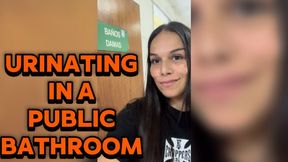 Urinating in a public bathroom