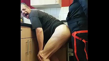 girlfriend surprises bisexual boyfriend with a strap-on assfuck in the kitchen