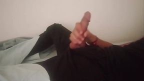Horny guy in black pants moaning and jerking off his big cock after work until he cums