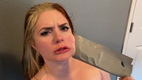 cute redhead dirty talks through her duct tape gag!