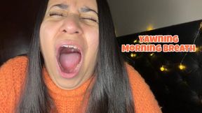 Yawning and letting my morning bad breath out