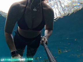 Bounty Hunter Carissa enjoys some underwater time and breast exposure in the spring