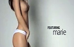 Breasty babe dancing by the wall