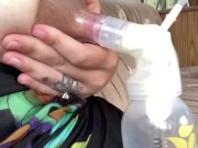 Milkymama in a bathing suit pumps milk filled tits while camping