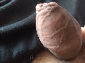 Gay boy shows the foreskin of his enormous cock